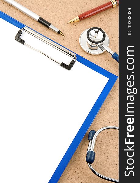 Medical stethoscope with form blank on wood