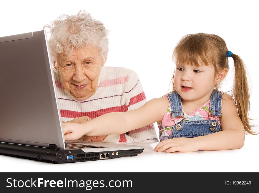 Grandmother With Grand Daughter At The Computer