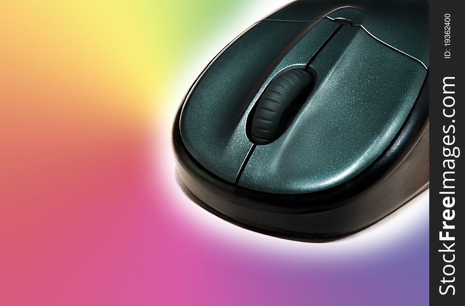 Wireless mouse on a colourful background