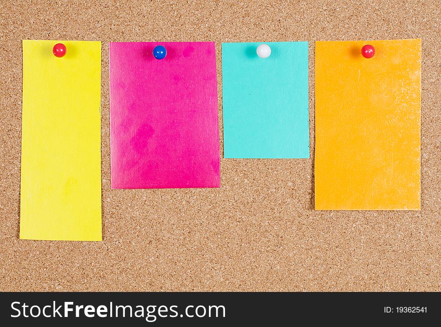 Collection of various note papers on corkboard