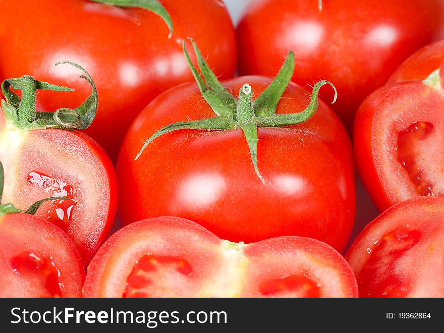 Many fresh red tomatoes background