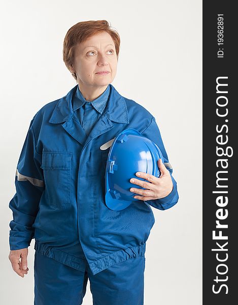 Adult woman holding a blue helmet. Adult woman holding a blue helmet