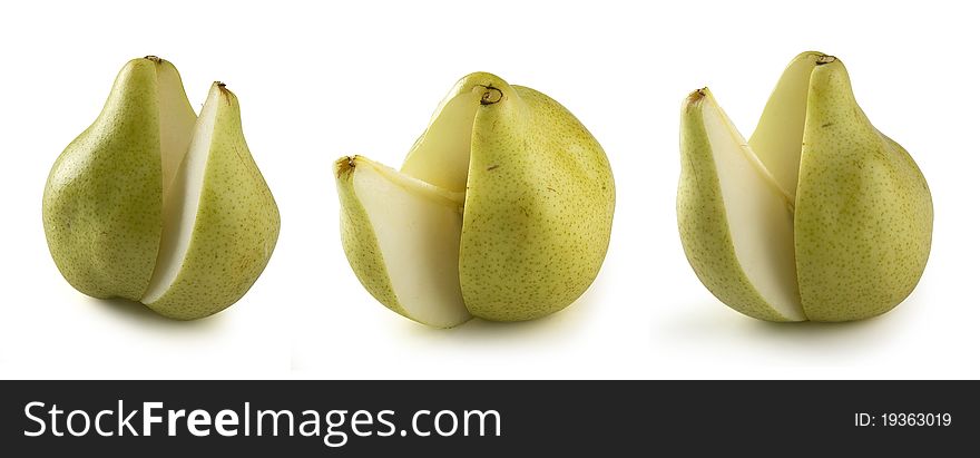 Some yellow pears with cut off segment on the white background