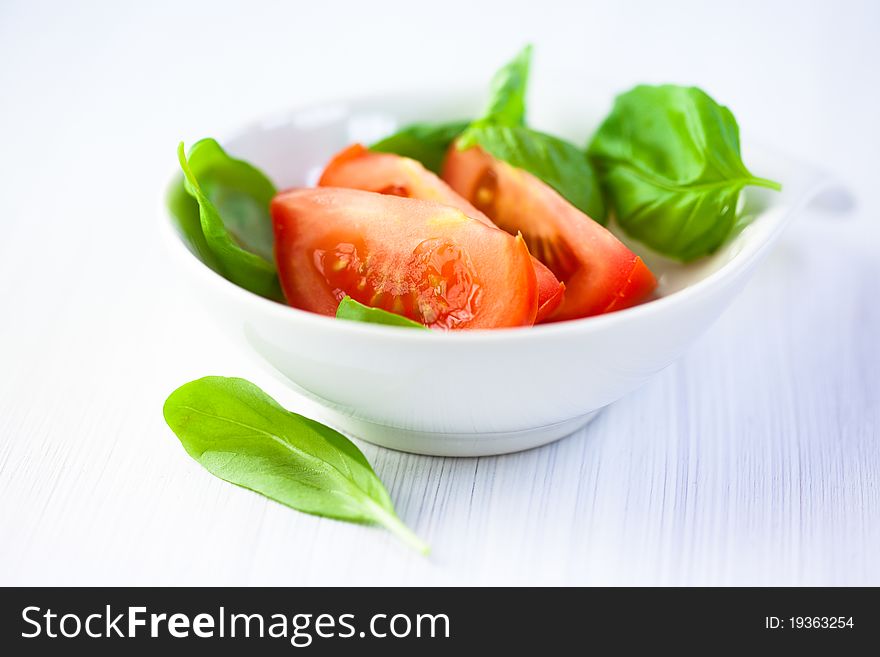 Fresh tomato and basil leaves for salad
