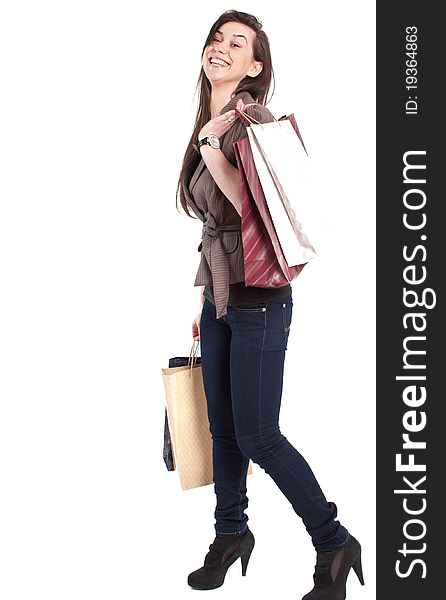 Woman holding shopping bags against a white background