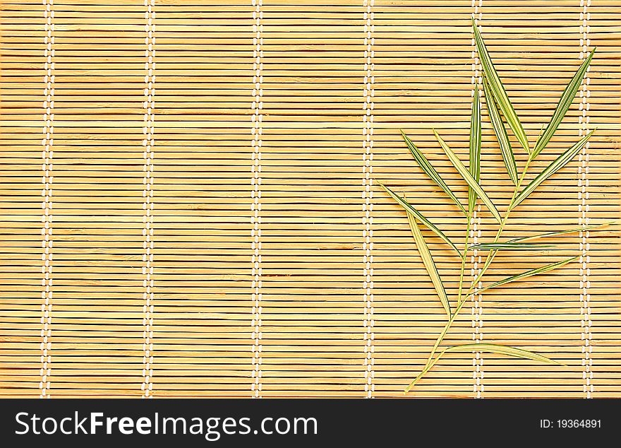Bamboo leaves on bamboo pad