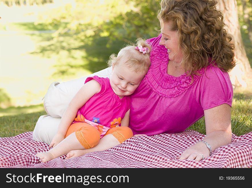 Mother and Daughter on Blanket in the Park