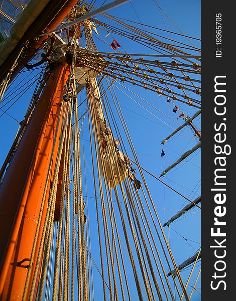 Masts of vessel on the blue sky. Masts of vessel on the blue sky