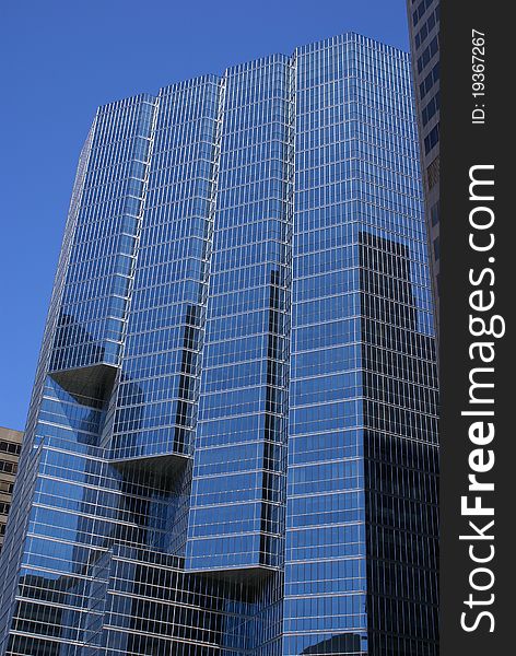 Highrise office building reflecting blue sky on windows. Toronto ON. Highrise office building reflecting blue sky on windows. Toronto ON