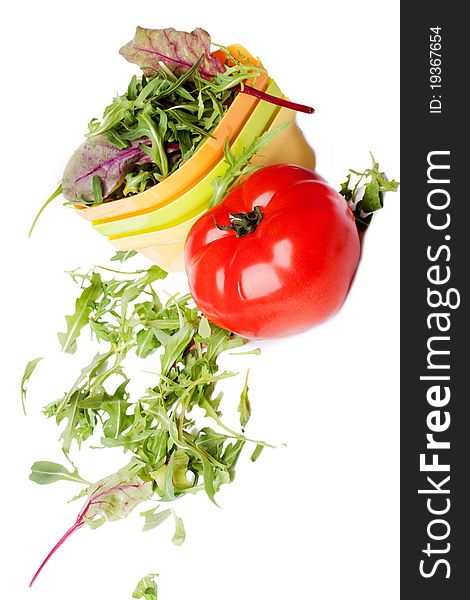 Fresh tomato and a plate of salad (isolated on a white background)