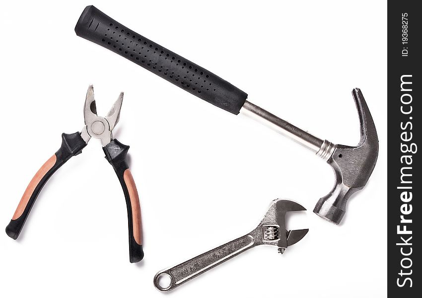 Three construction tools on white background