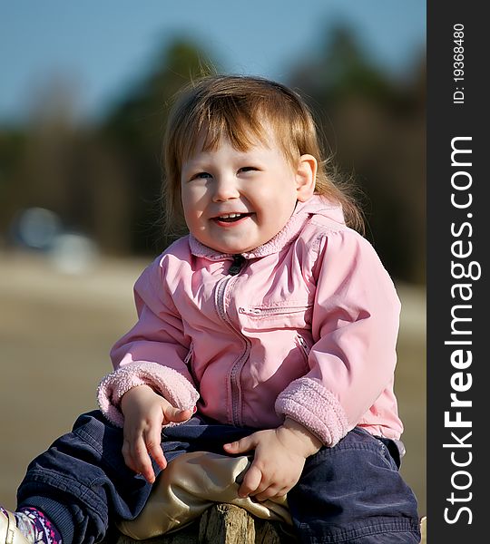 Portrait of happy baby girl in park