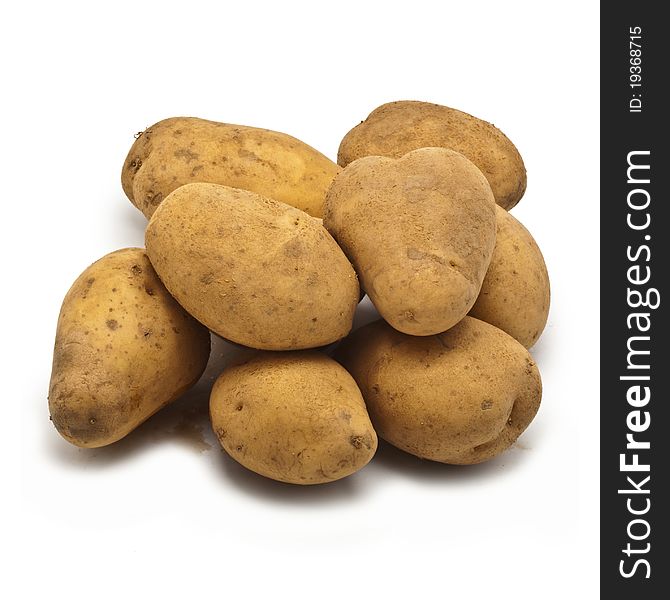 Freshly harvested potatoes isolated on white background
