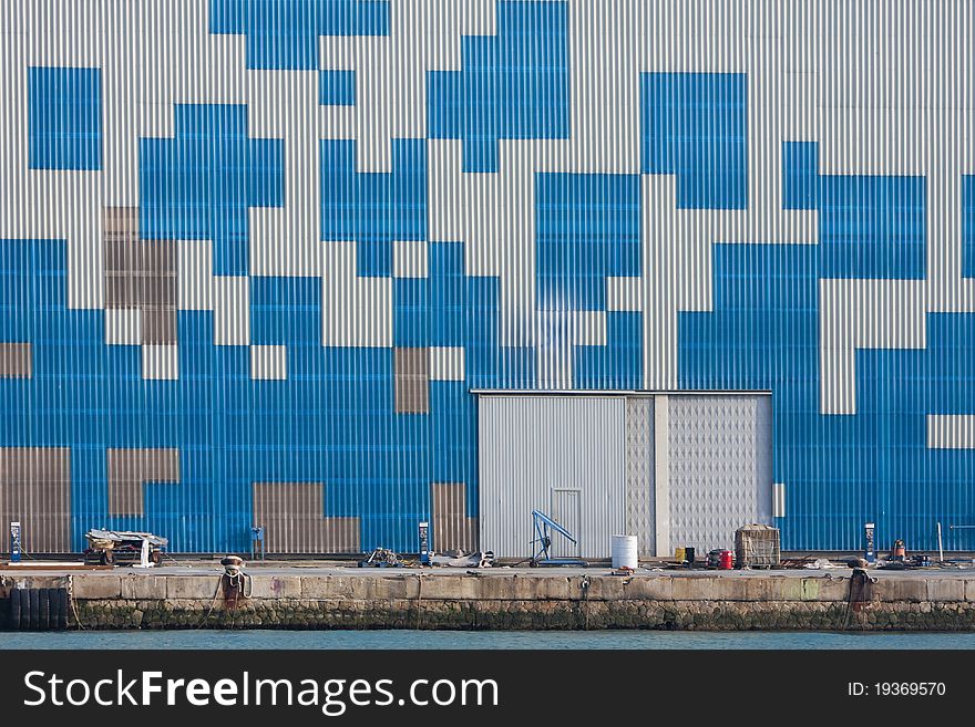 Geometric blue geometric forms on a metal wall. Geometric blue geometric forms on a metal wall