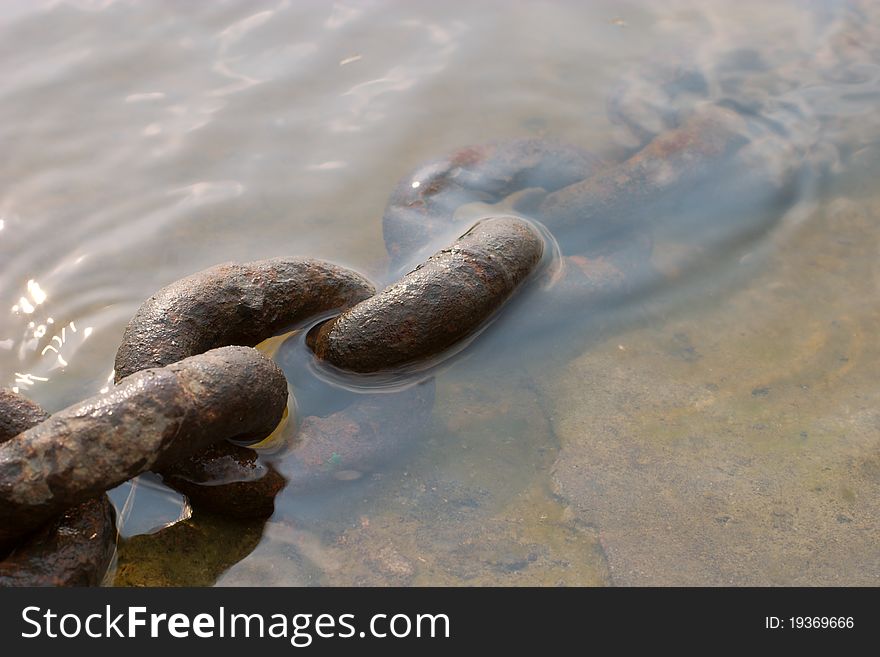 Rusty chain on a water