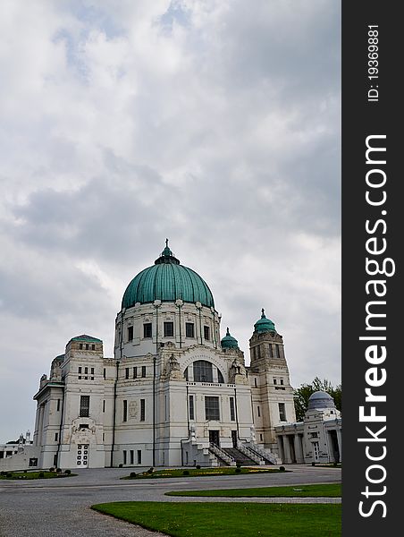 Impressive  art deco church at viennas central cemetery in front of overcast sky. Impressive  art deco church at viennas central cemetery in front of overcast sky