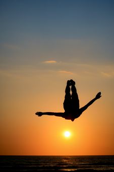 Silhouette Of Man Jumping In Sunset Stock Photography
