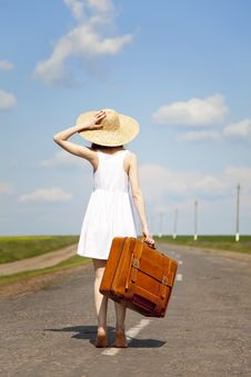Lonely Girl With Suitcase At Country Road. Stock Photo Lonely Girl With Suitcase At Country Road. Stock Photo