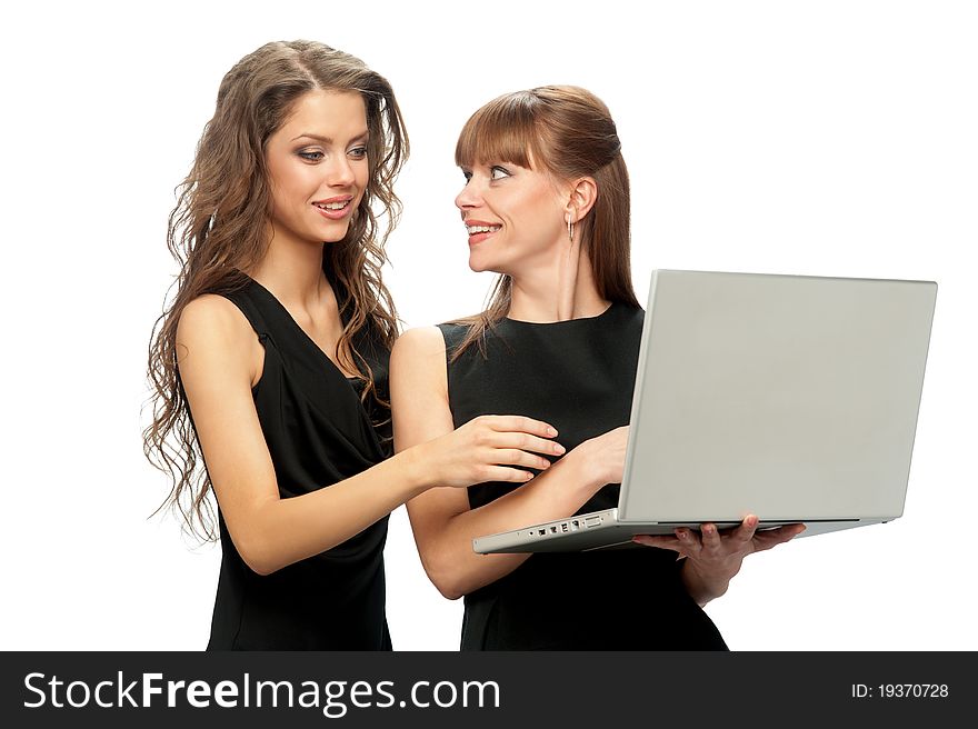 Two women working on a laptop