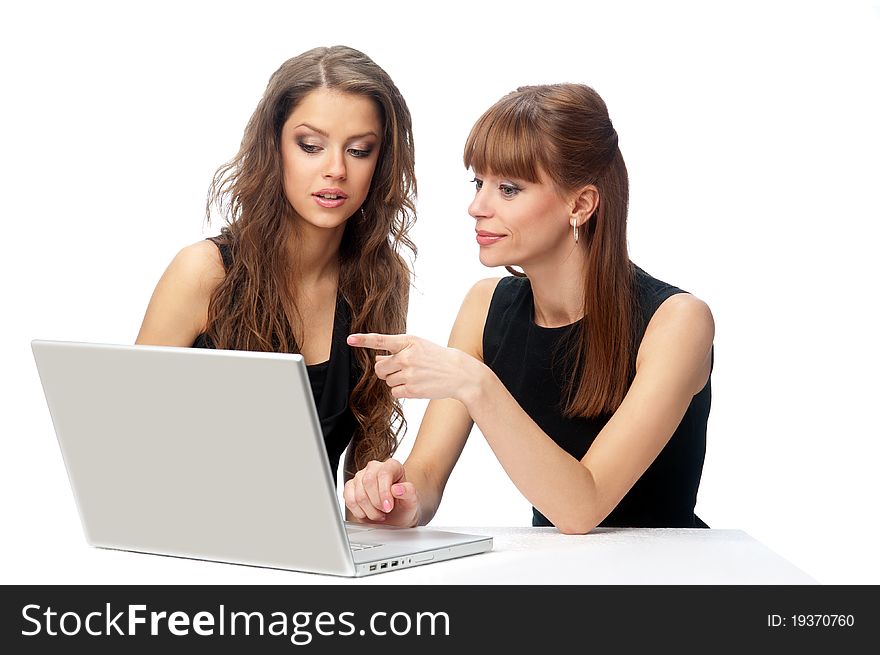 Two Women Working On A Laptop