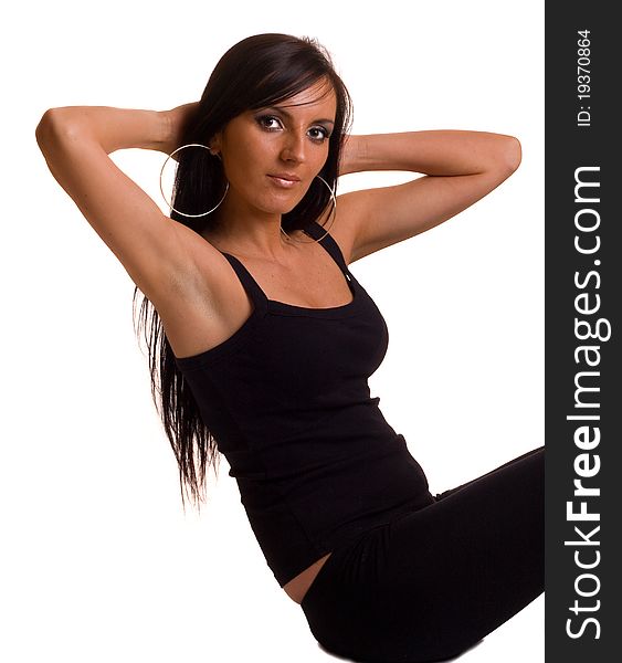 A young woman exercising isolated on a white background. A young woman exercising isolated on a white background.