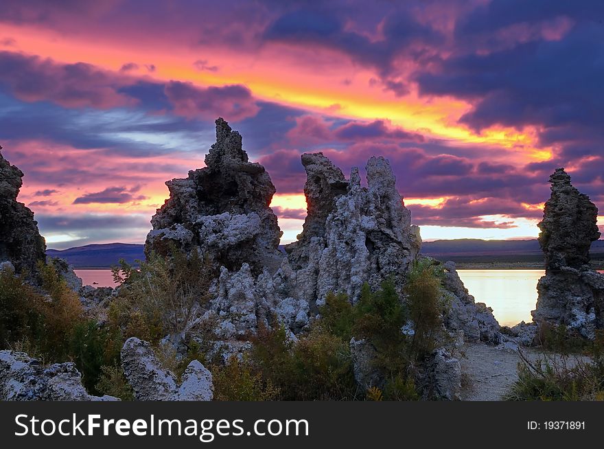 Sky in fire at mono lake with stufas in the foreground