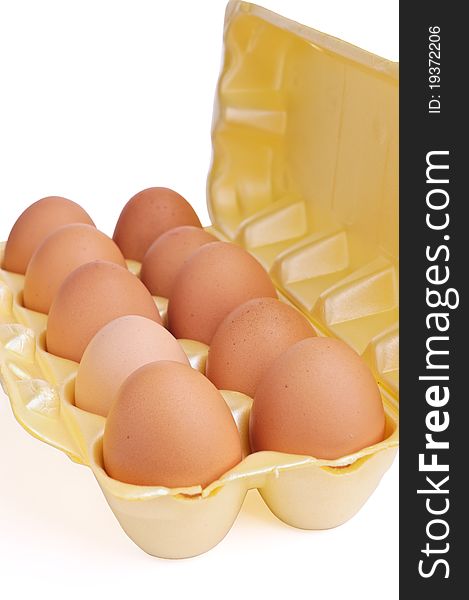 Eggs in packing from a cardboard on a white background.