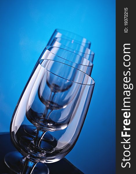 Group of wine glasses on colour a gradient a background