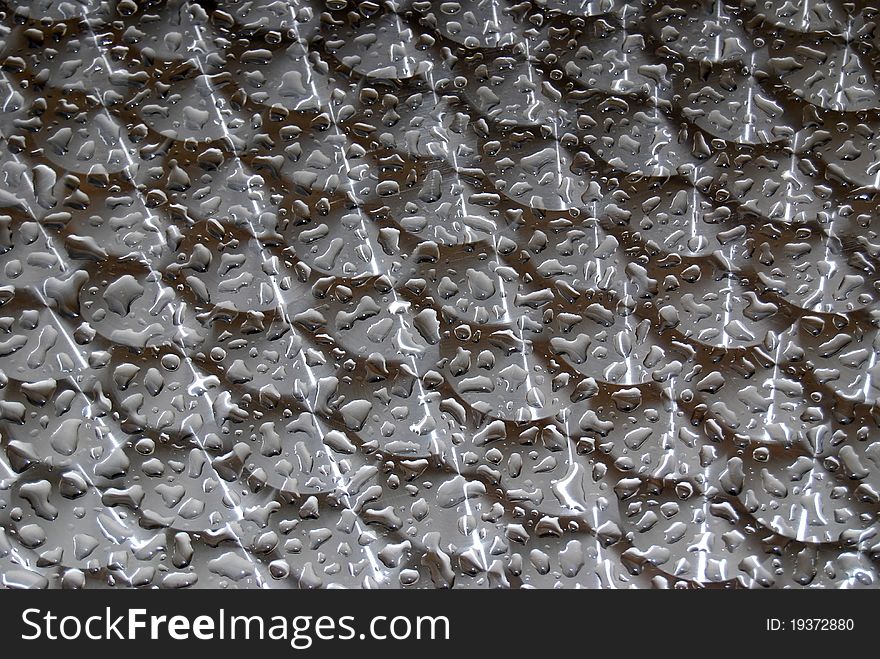 Texture of water droplets on a metallic table. Texture of water droplets on a metallic table