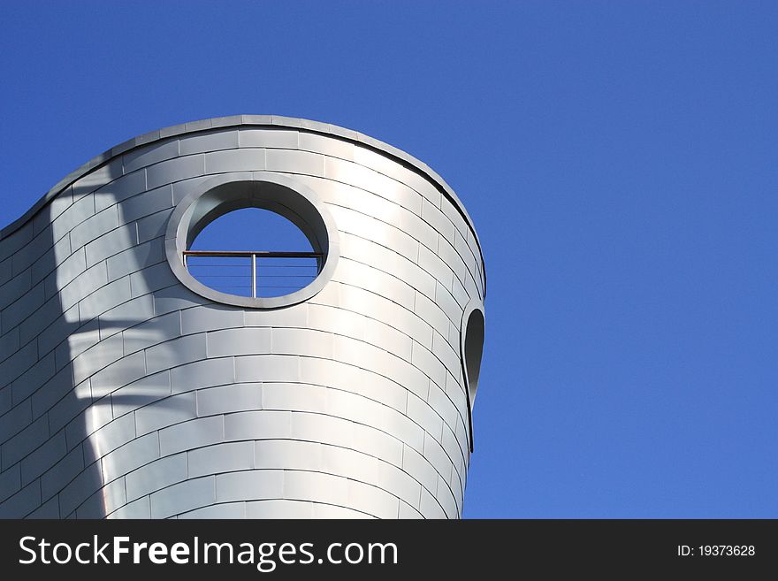 Modern architecture building in Warsaw, Poland. Blue sky background.