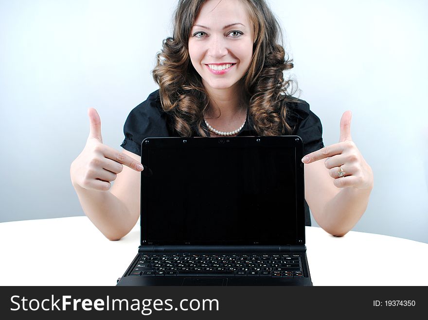Business woman showing blank laptop
