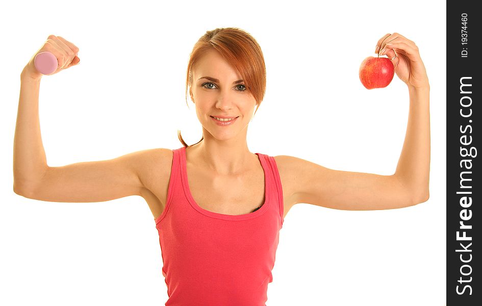 Woman with apple and dumbbell