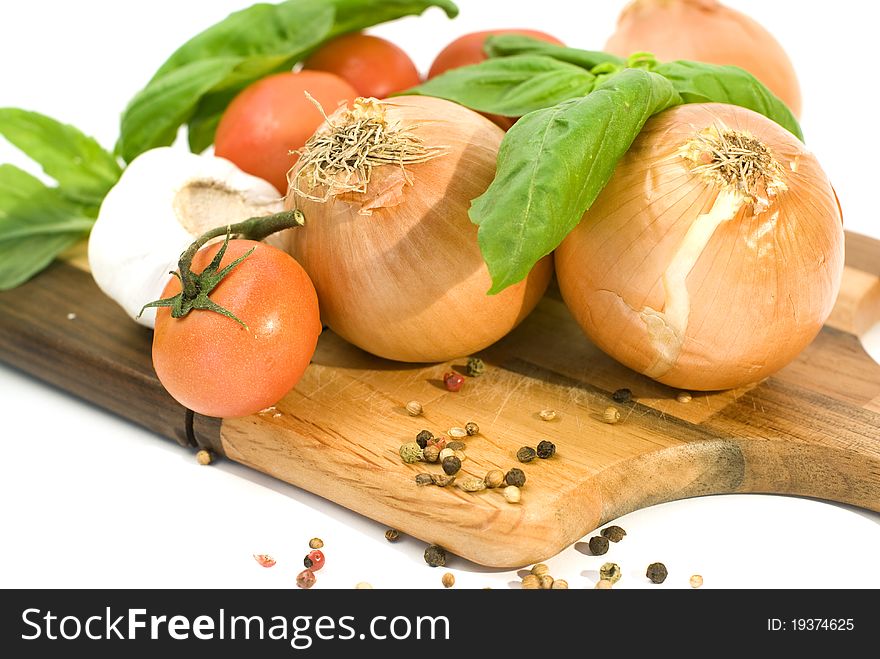 Tomatoes, onion, garlic, basil and spices with white background. Tomatoes, onion, garlic, basil and spices with white background