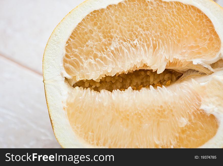 Sliced â€‹â€‹grapefruit on a rock table
