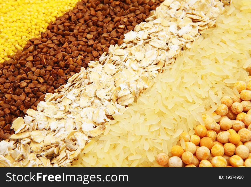 Various kinds of groats are spread out by numbers: a buckwheat, rice, peas, oat-flakes, groats. Various kinds of groats are spread out by numbers: a buckwheat, rice, peas, oat-flakes, groats