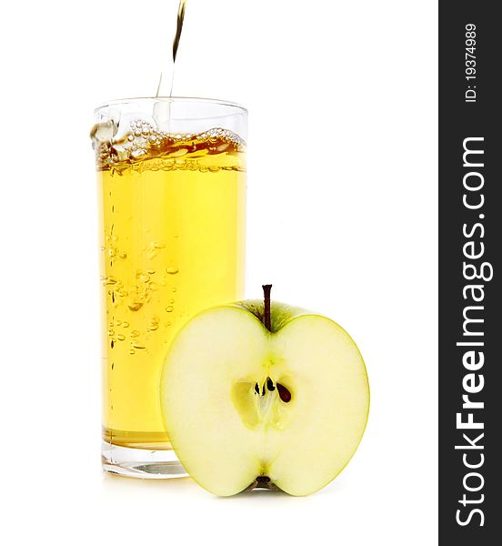 Glass of apple juice and half of apple on a white background. Glass of apple juice and half of apple on a white background