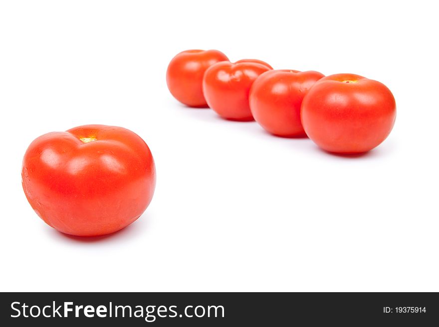Some red tomatos in group isolated on white background