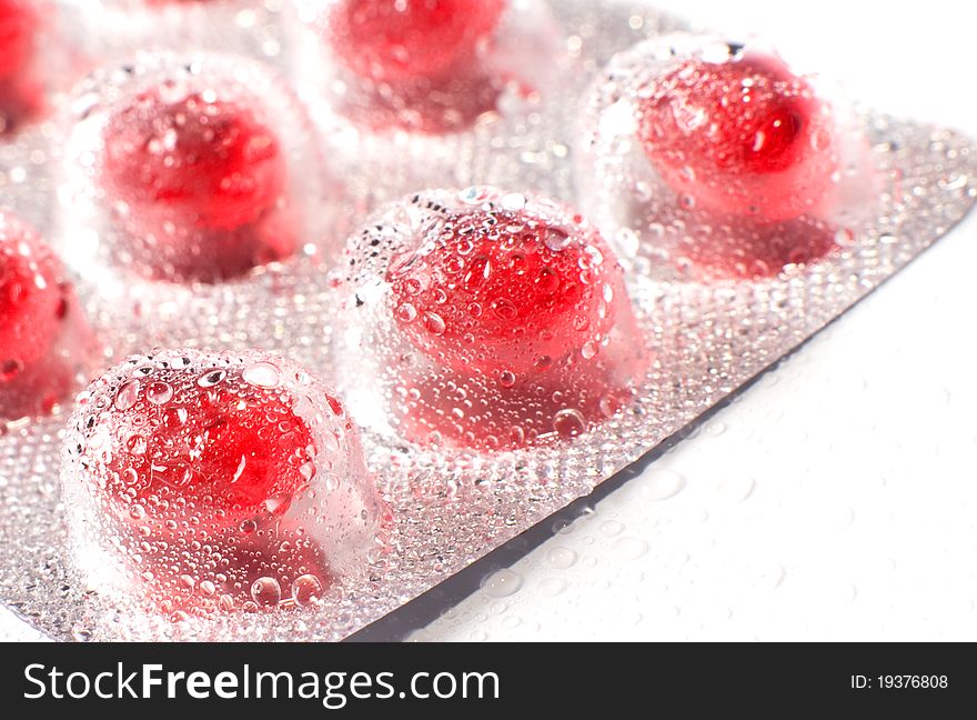 Blister packs of pills with water droplets