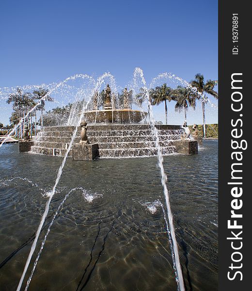 Water sprays and flows over the fountain brick work