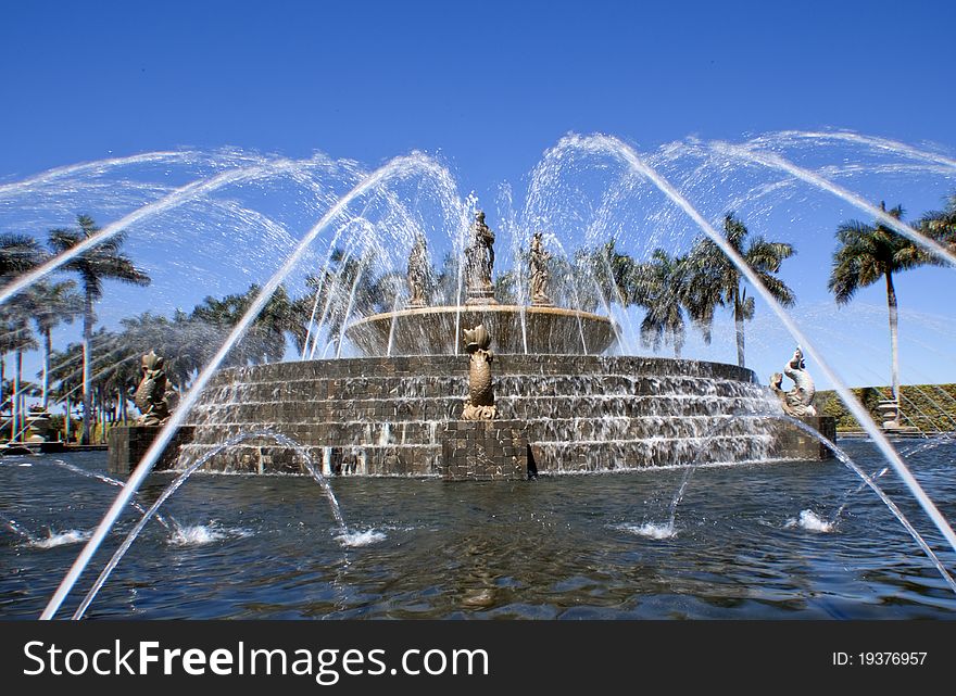 Water sprays and flows over the fountain brick work