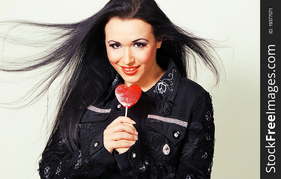 Lovely brunette with a lollipop. Lovely brunette with a lollipop
