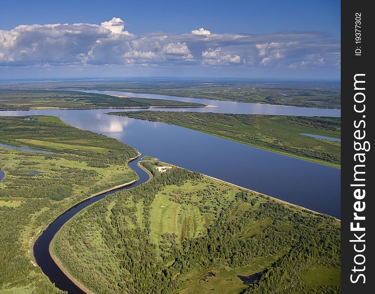 Aerial view of a large lowland river.