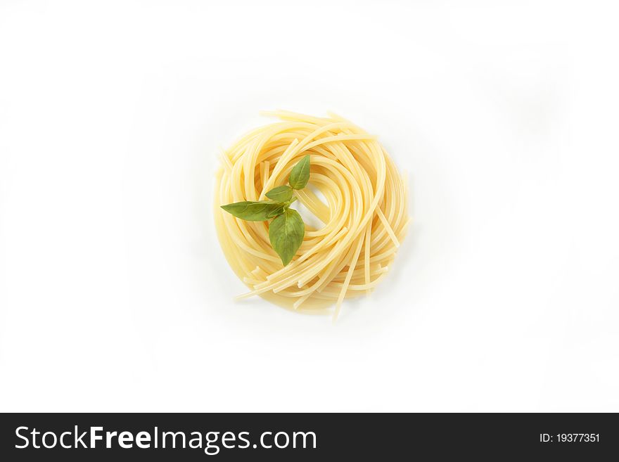 Portion of spagetti in a dish on a white background. Portion of spagetti in a dish on a white background