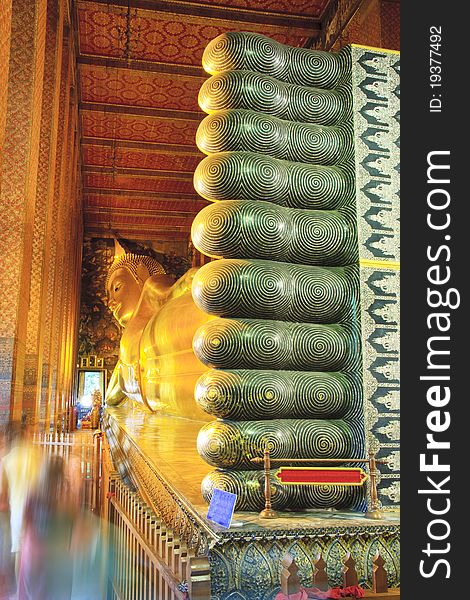 The golden Reclining Buddha in Sanctuary Wat Pho in Bangkok, Thailand. The golden Reclining Buddha in Sanctuary Wat Pho in Bangkok, Thailand
