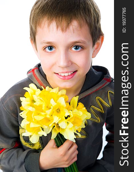 Cute little boy giving flowers. Studio shot