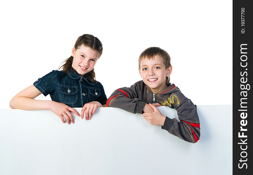 Two smily kids isolated over white background