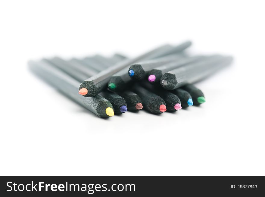 Black coloured pencils spread with white background. Black coloured pencils spread with white background
