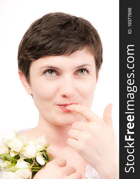 Beautiful brunette with finger at lips portrait on white background