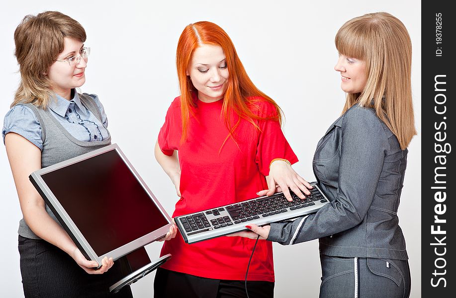 Women with a monitor and keyboard on grey background