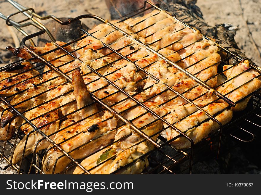 Chicken barbecue roasting on an open fire